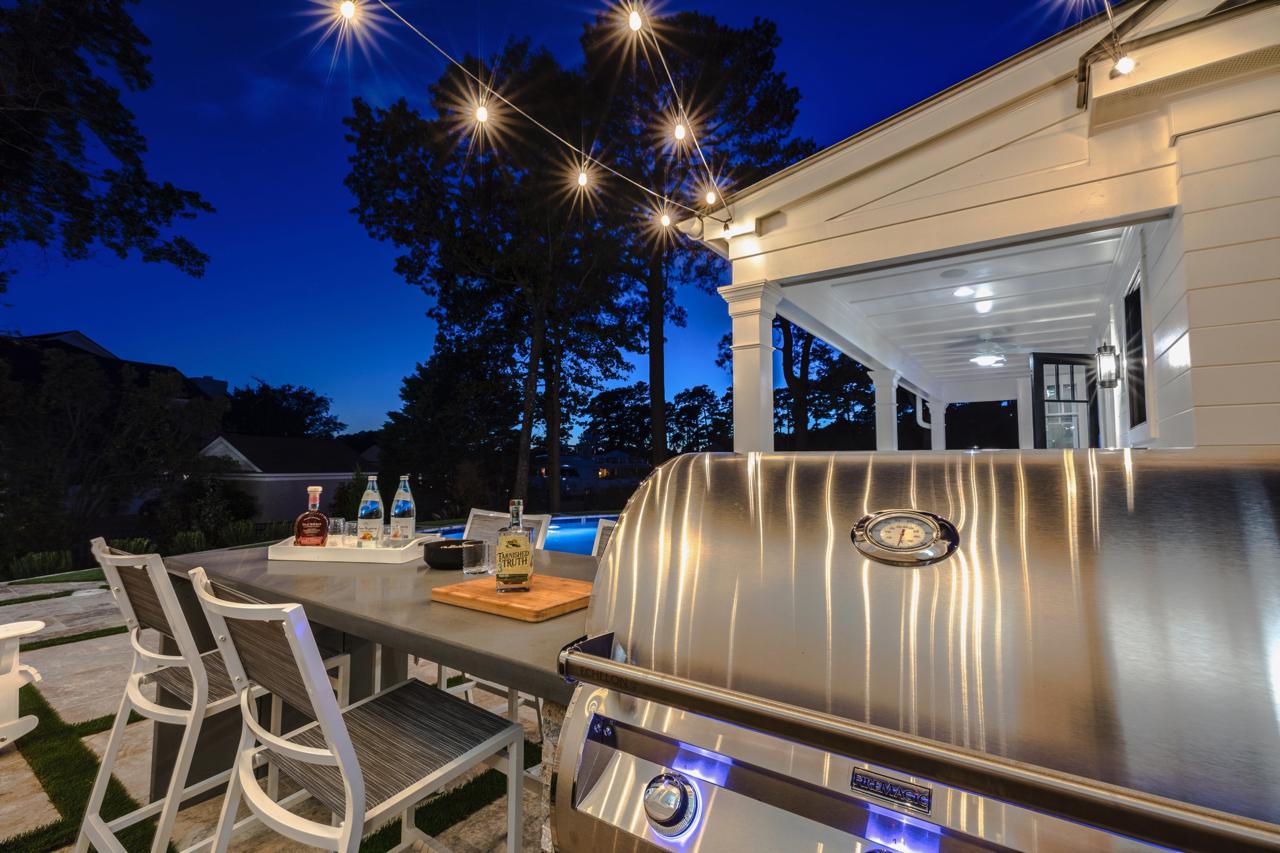 Elegant rear exterior with view of seating area and grill | Exterior Gallery | Stephen Alexander Homes | Chesapeake, VA
