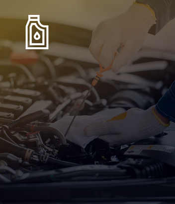 A person is pouring oil into a car engine. | Beacon Auto Repair Center