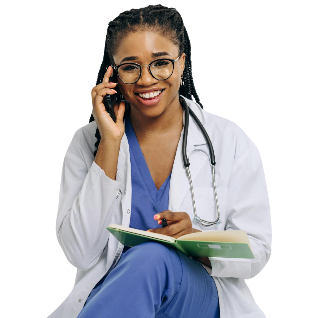 A woman in a striped shirt is standing with her arms crossed and smiling.