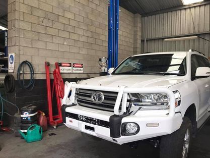 White Car Parked in Garage — Ulladulla, NSW — B & D Automotive Repairs
