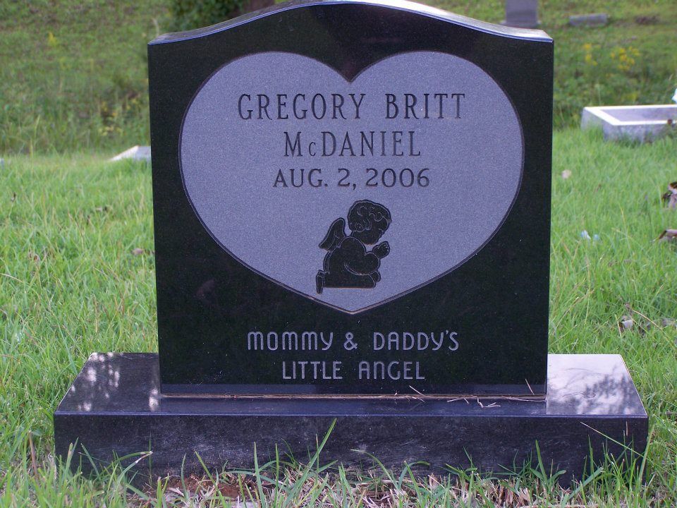 Black headstone with a heart, Gregory Britt McDaniel, Aug. 2, 2006, with angel graphic, 