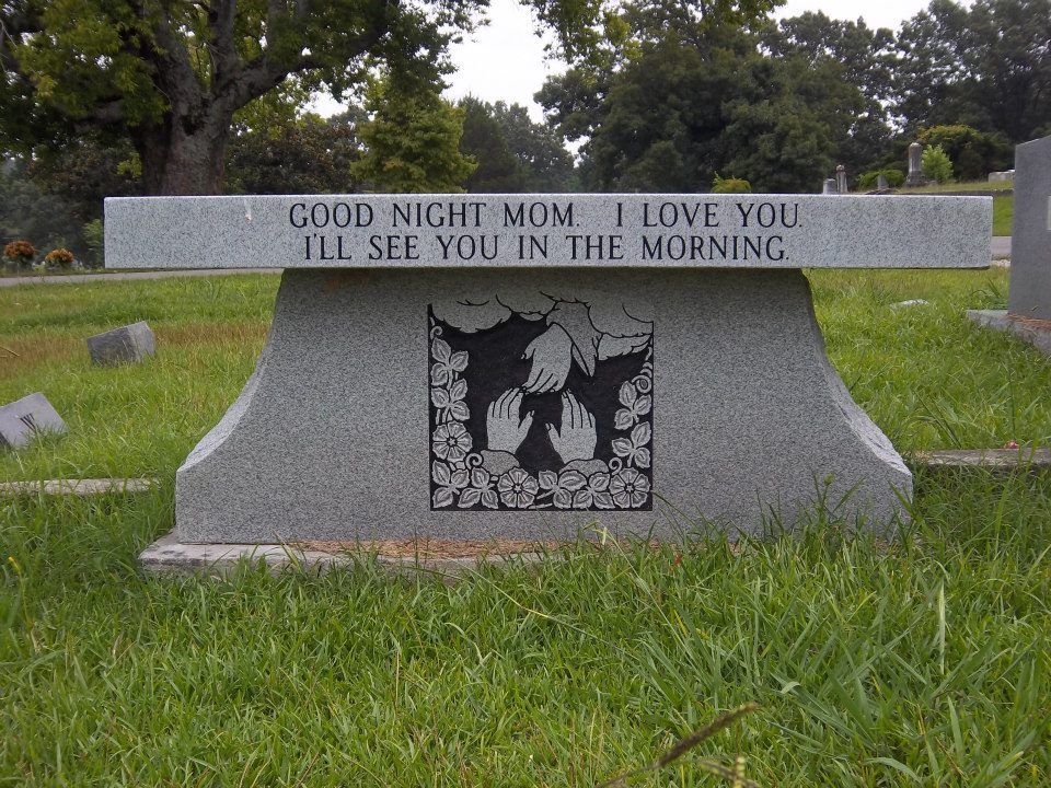 Gray granite bench inscribed