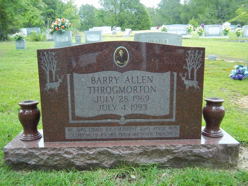 Red granite headstone in a cemetery; name