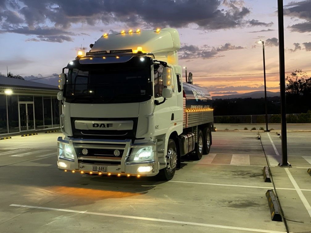 A White Truck is Parked in a Parking Lot at Night — Water TopUps Gympie in Curra, QLD