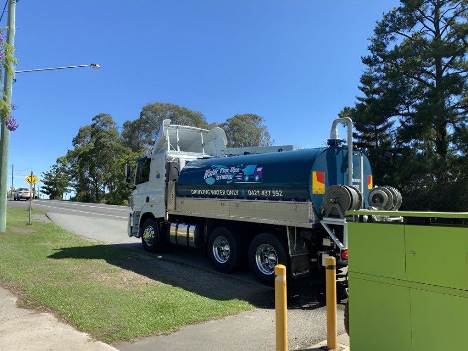 A Blue and White Truck is Parked on the Side of the Road — Water TopUps Gympie in Curra, QLD