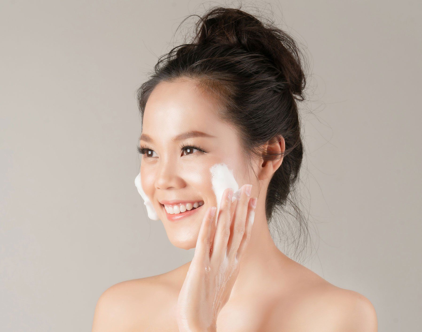 Asian Woman Using Facial Foam ─ Columbus, OH ─ Encore Dermatology