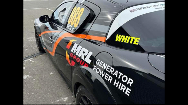 A black car with the word generator on the side