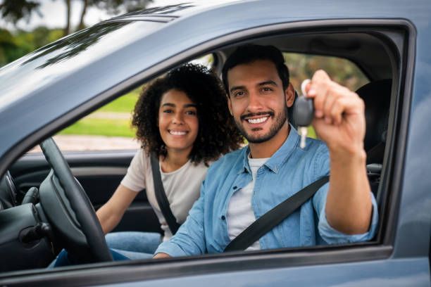 A Man Holding A Car Key — Thornton, CO — Thornton Westminster Locksmith