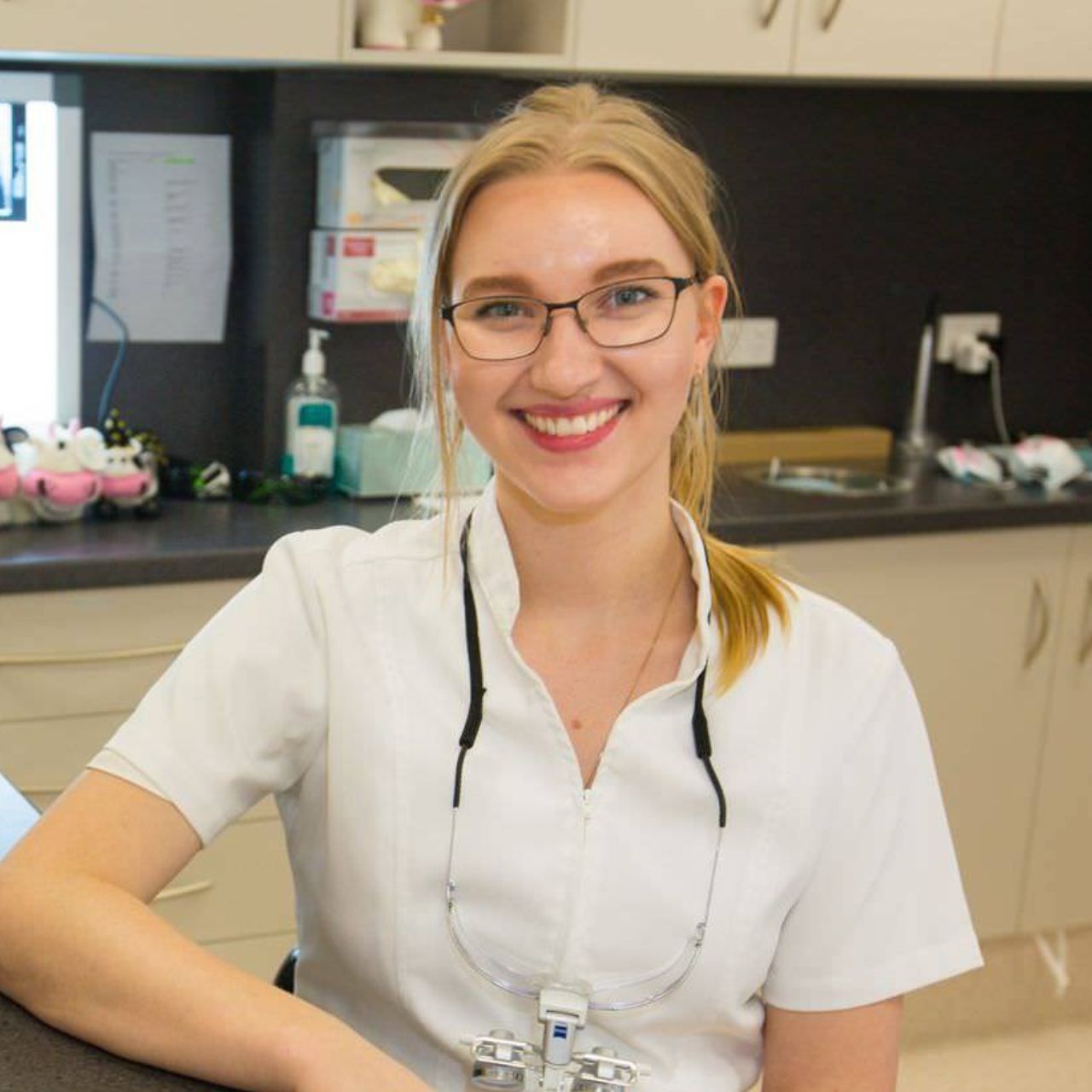 Shenade Smith from Cairns Dental Anaesthetic Centre - a woman wearing glasses and a white shirt smiles for the camera