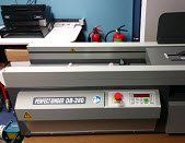 Perfect binding machine in Colour Inc print shop