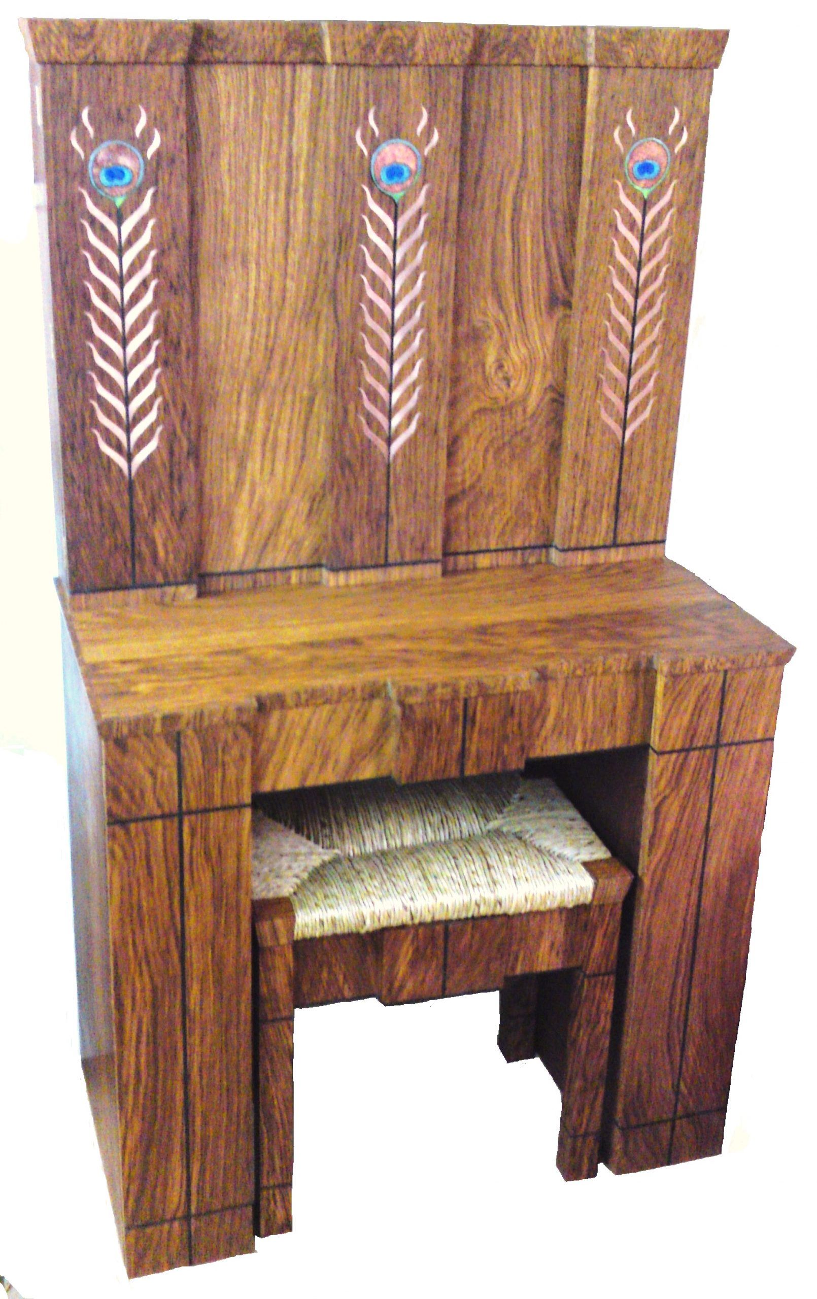 A wooden vanity with peacock feathers painted on it