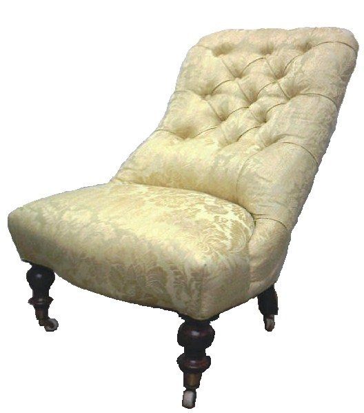 A tufted chair with wooden legs on a white background
