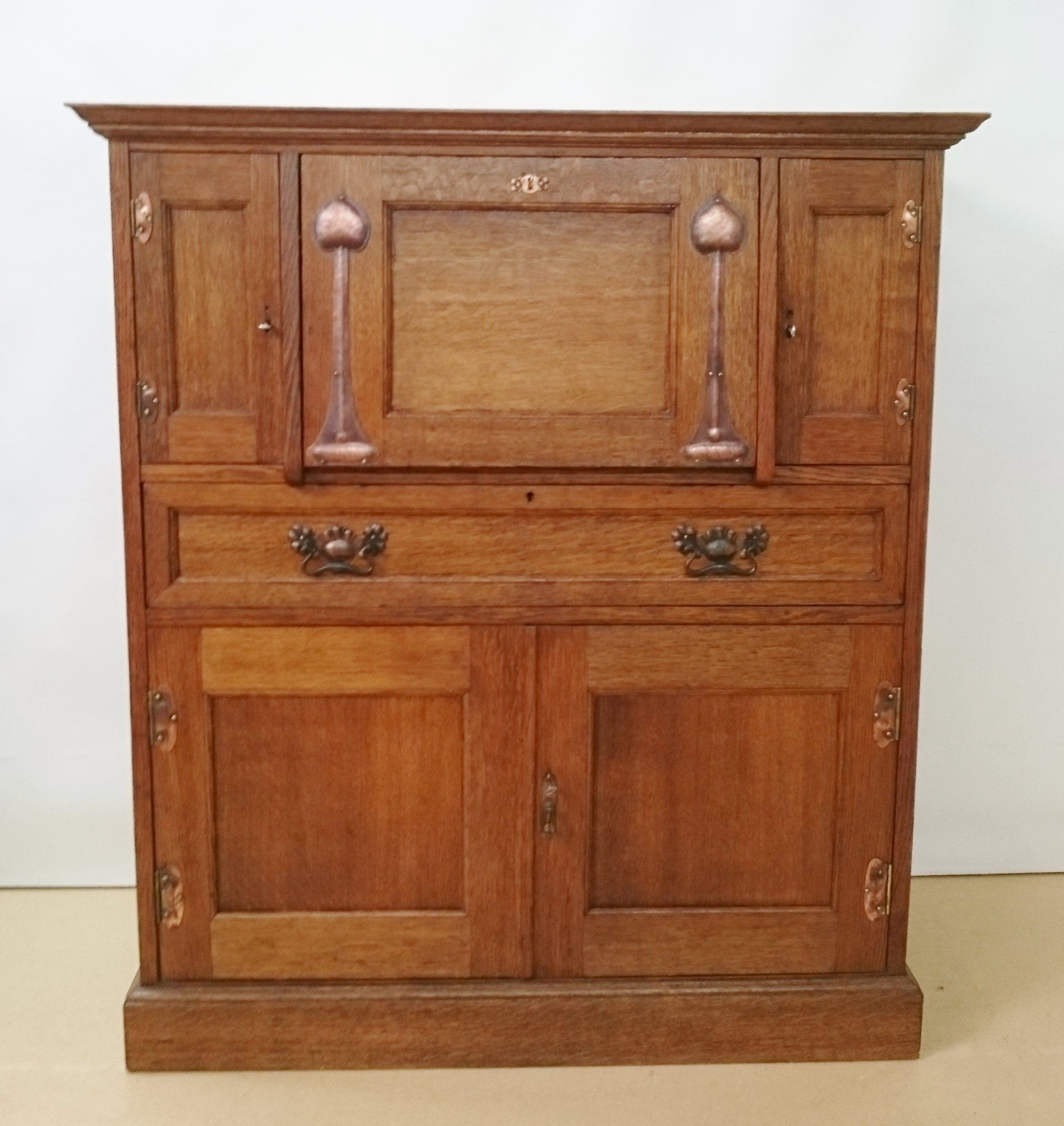 A wooden cabinet with two drawers and two doors