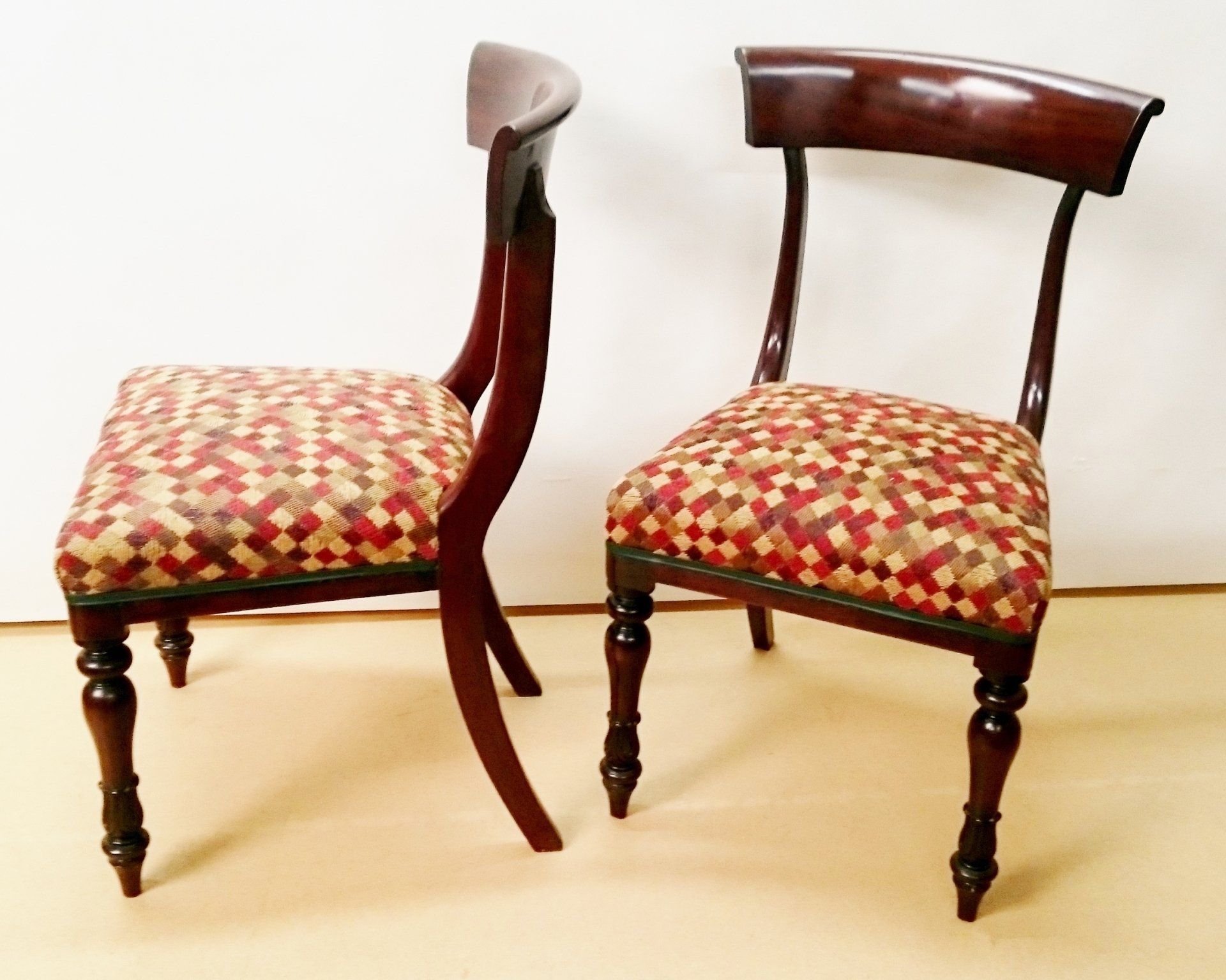 Two chairs are sitting next to each other on the floor