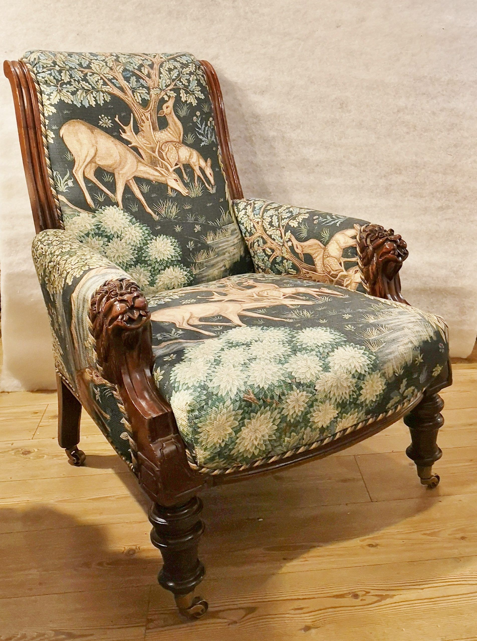 A chair with a deer on the back of it