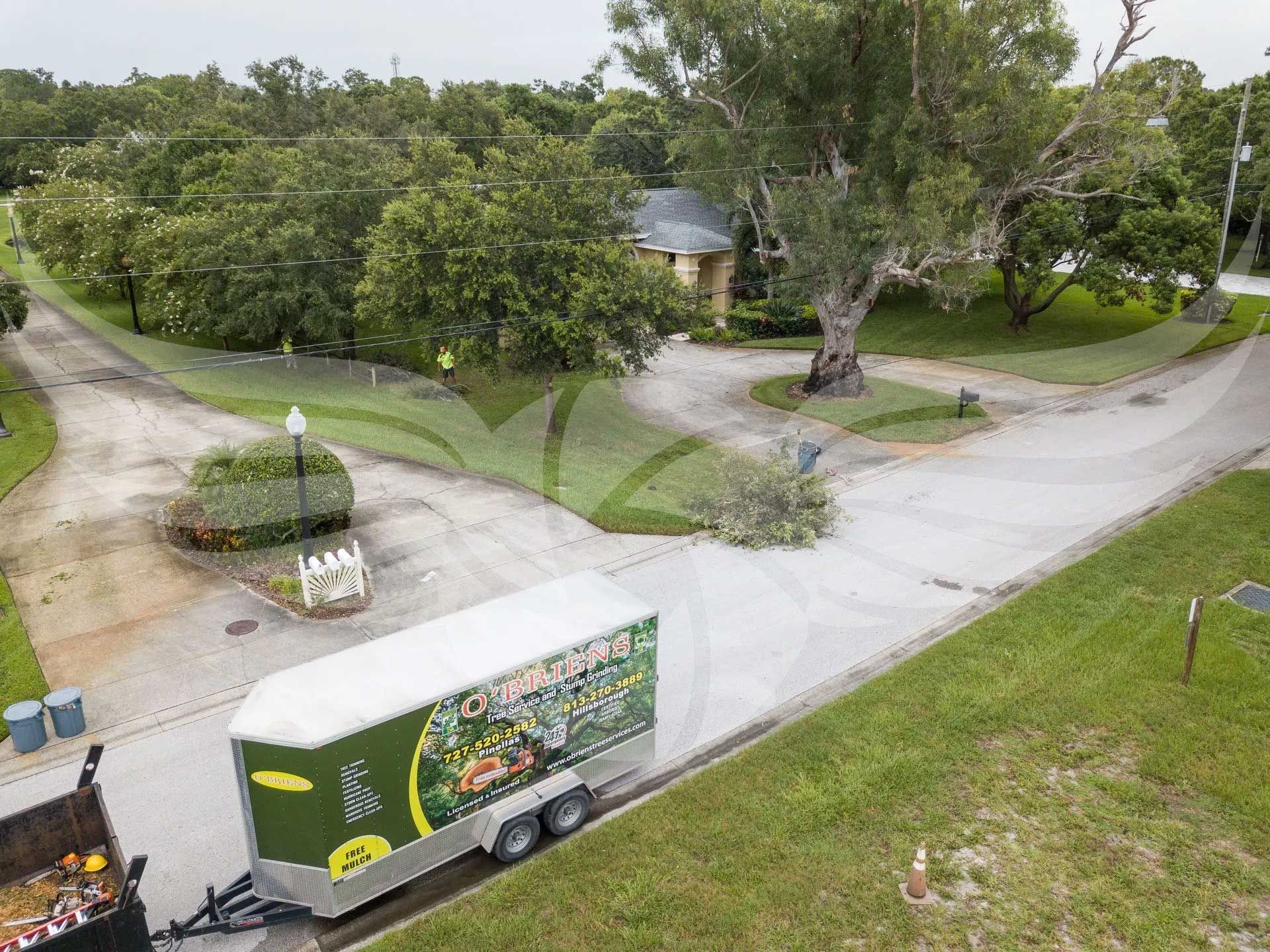 An aerial view of a trailer parked on the side of a road.