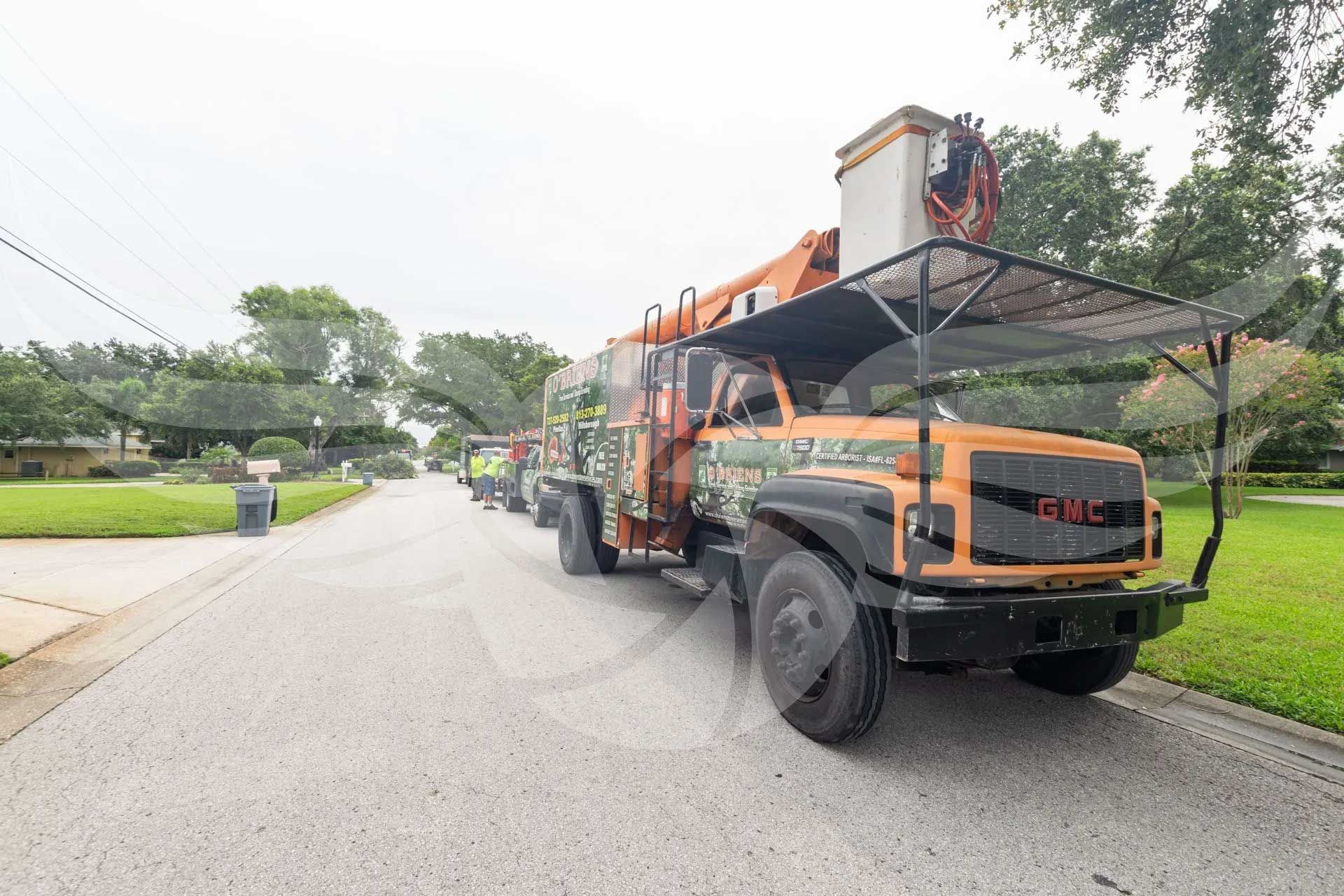 A gmc truck is parked on the side of the road.
