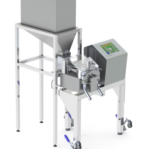 Industrial food processing machine with stainless steel components, digital display, and hopper.