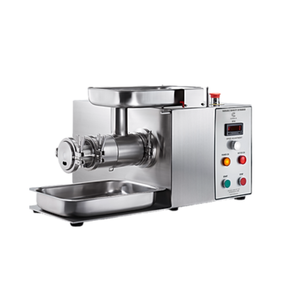 Row of amber vials being filled by automated machinery in a factory setting.