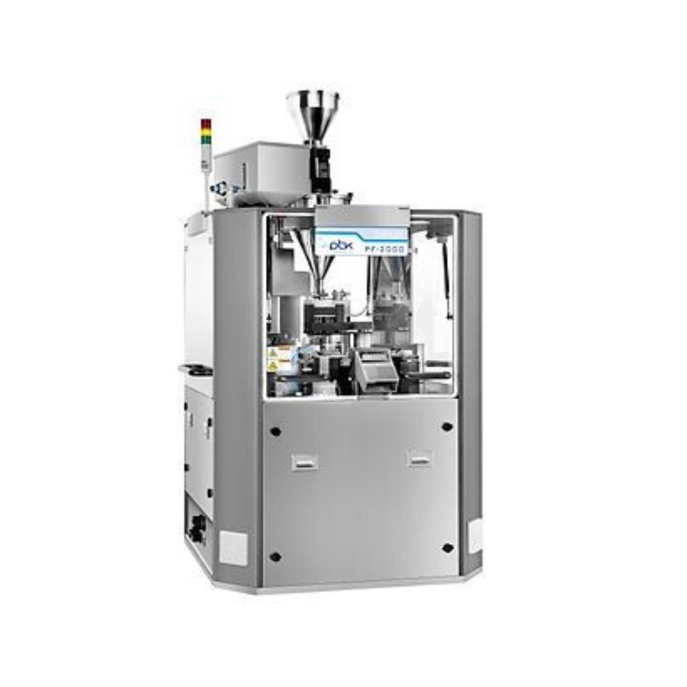 Automated bottle-capping machine in operation. Brown glass bottles are filled and sealed with white caps on a metal surface.