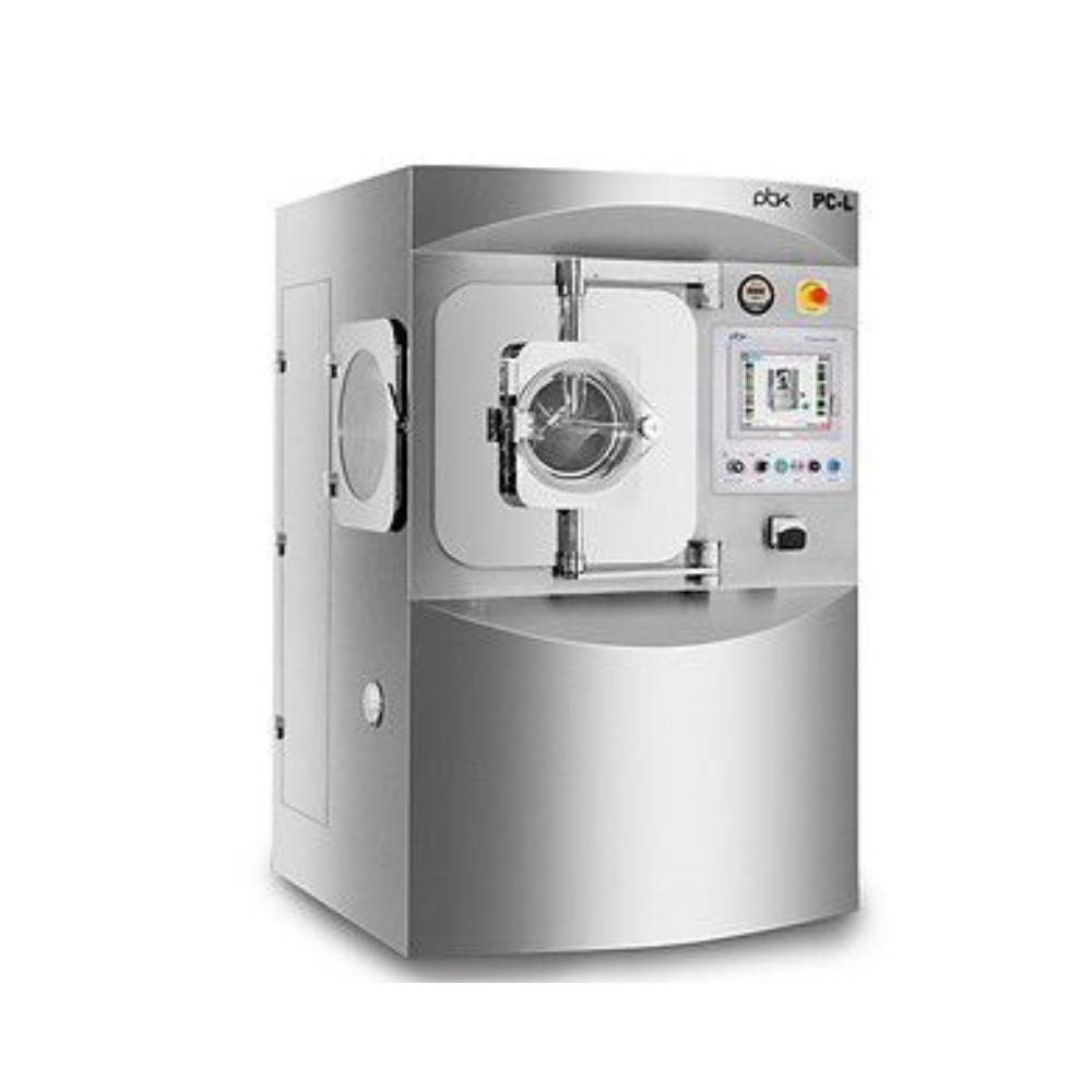 Capsule pills moving through a metal conveyor belt in a pharmaceutical factory.