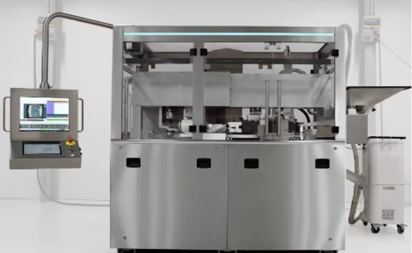 Stainless steel pharmaceutical filling machine with touchscreen display.