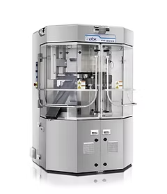 Pill press machine with clear safety panels. Silver casing with internal mechanisms visible, in a clean, professional setting.