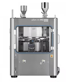 A silver pharmaceutical tablet press machine with two hoppers.