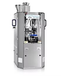 Encapsulation machine, silver and grey, with internal components visible through clear panels.