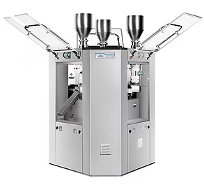 Pill press machine with three hoppers, doors open, and a metal exterior in a lab setting.