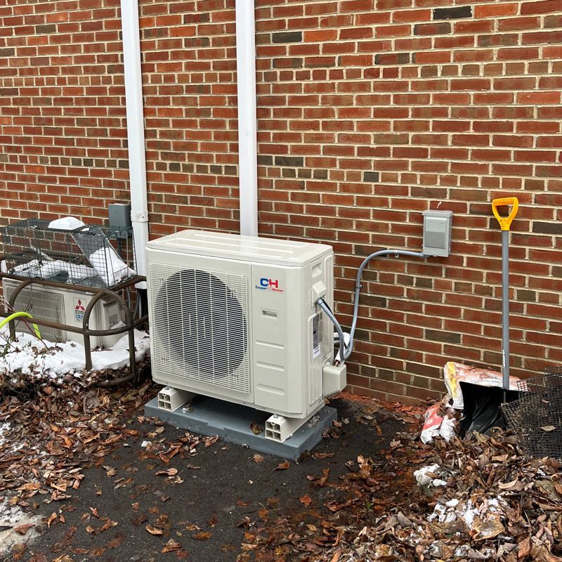 A white box with four fans on top of it