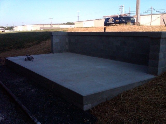 A black van is parked on the side of the road