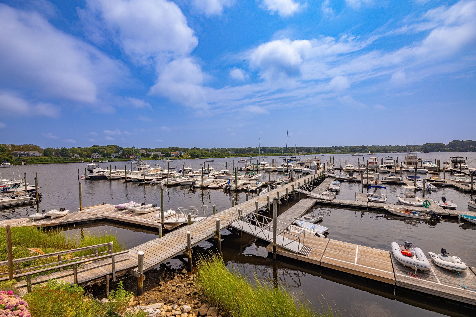 A marina filled with lots of boats on a sunny day.