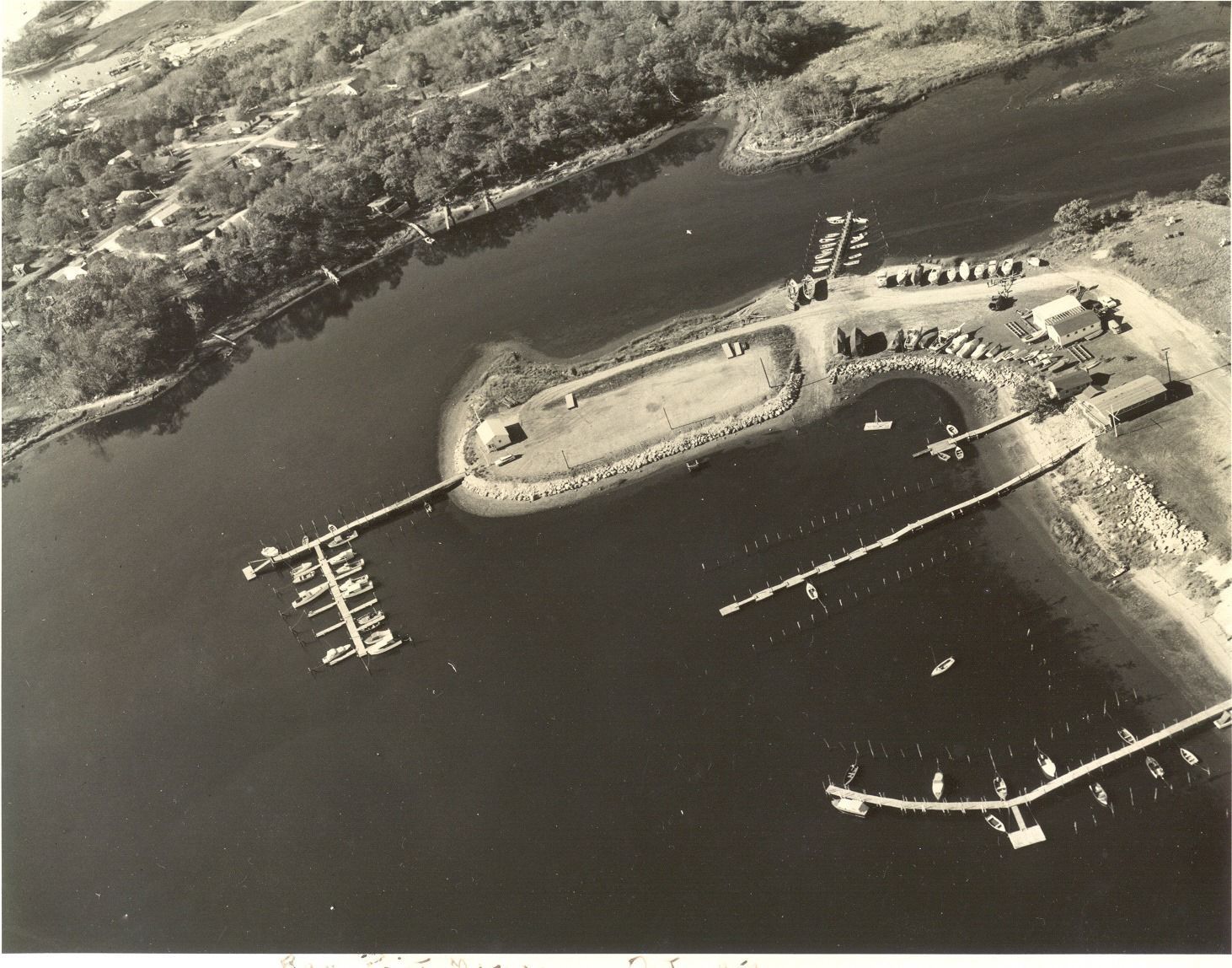 An aerial view of a marina with boats docked