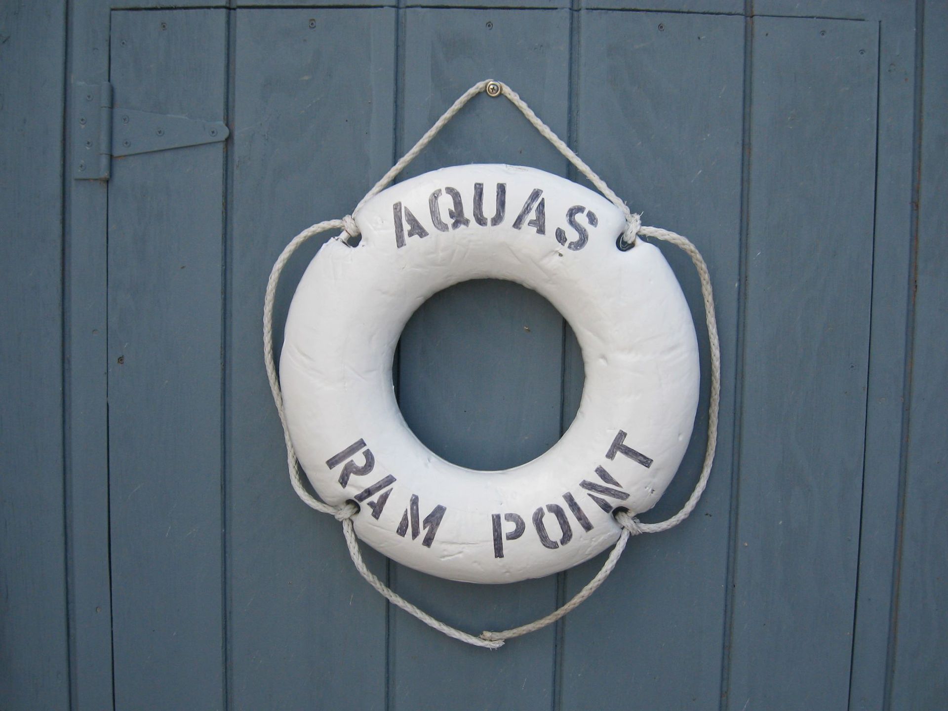 A white life preserver with the words aquas ram point on it
