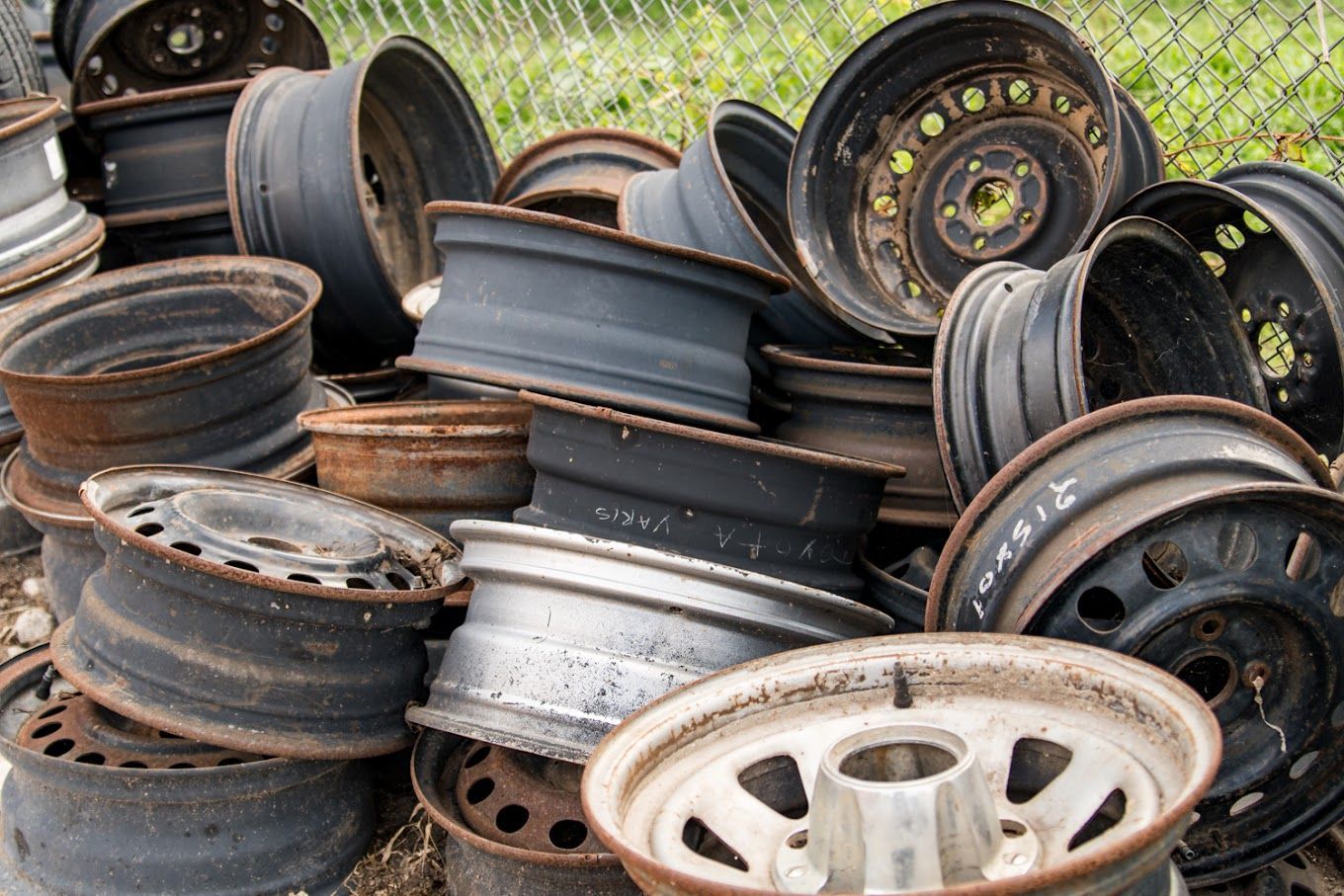 A pile of wheels with one that says ' a ' on it