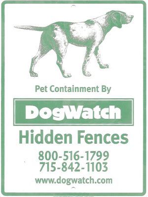A white sign with a green dog illustration,