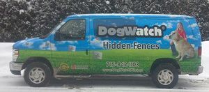 A blue and green DogWatch Hidden Fences van parked in the snow with a dog and child pictured on the side.
