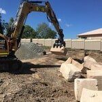 Excavator Picking Big Rocks — K & T Daley in Gracemere, QLD