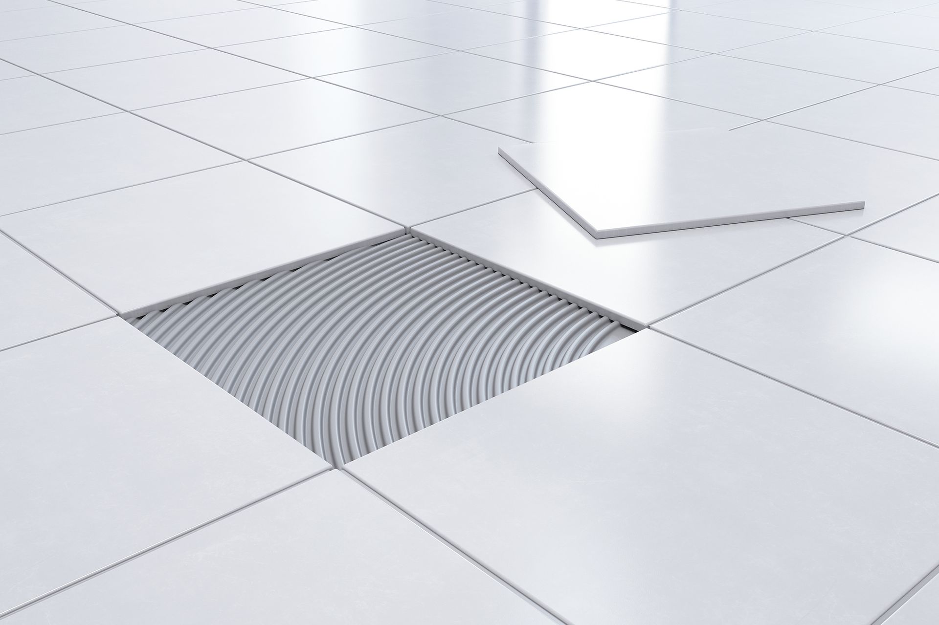 A white tile floor with a hole in it.
