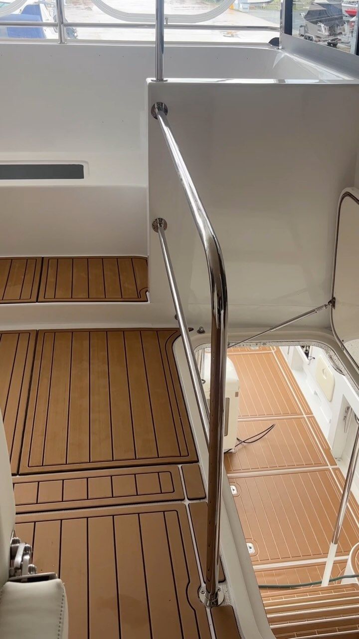 Interior of a Boat With Brown Textured Flooring, a Chrome Handrail — Master Metals Fabrication in Labrador, QLD