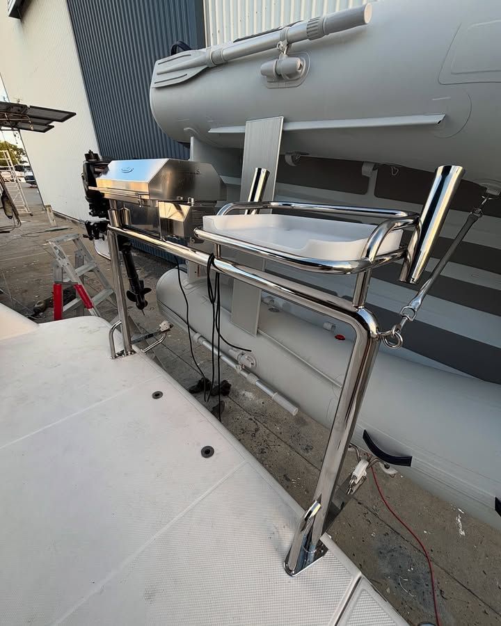Stainless Steel Boat Grill and Prep Station Mounted on a White and Gray Vessel — Master Metals Fabrication in Labrador, QLD