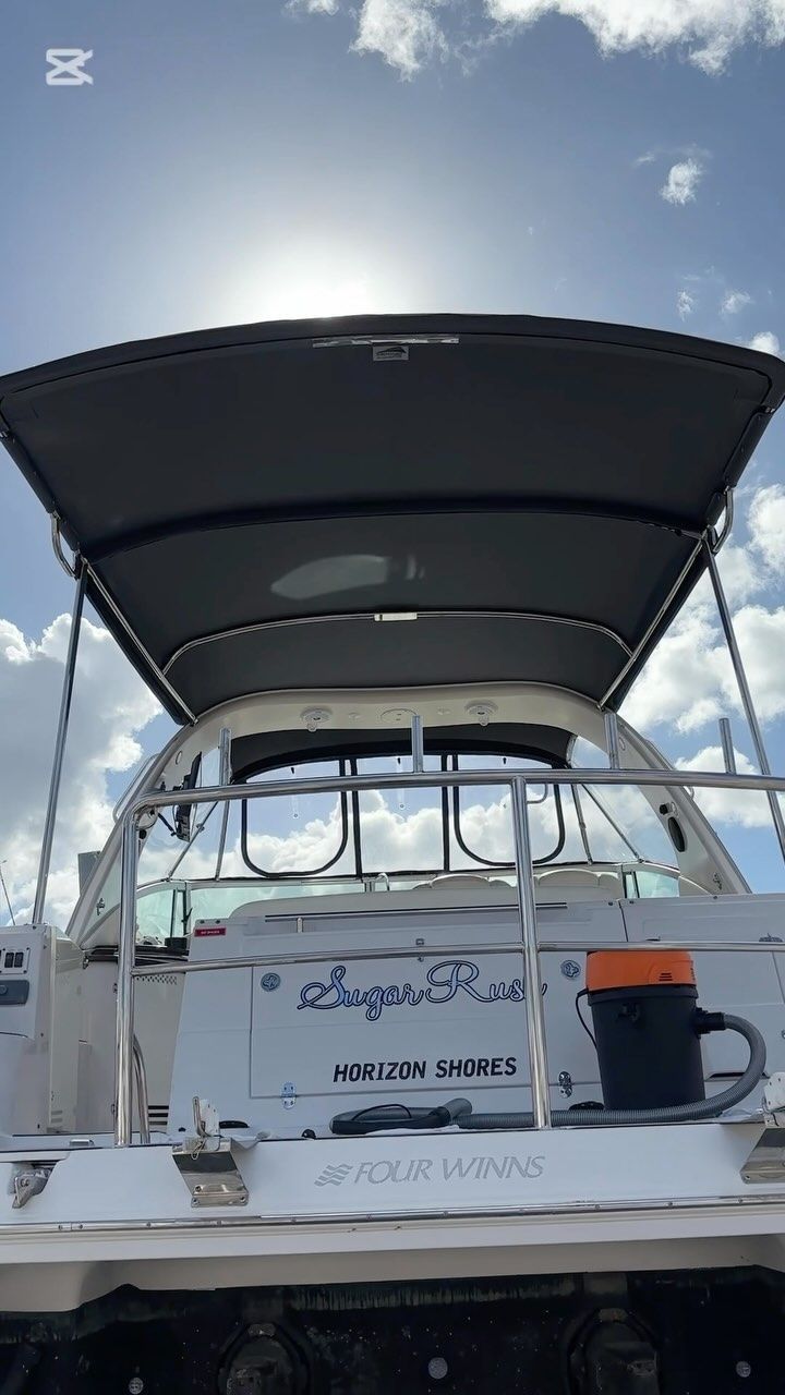 Back of a White Boat With a Gray Canopy Under a Sunny Sky — Master Metals Fabrication in Labrador, QLD
