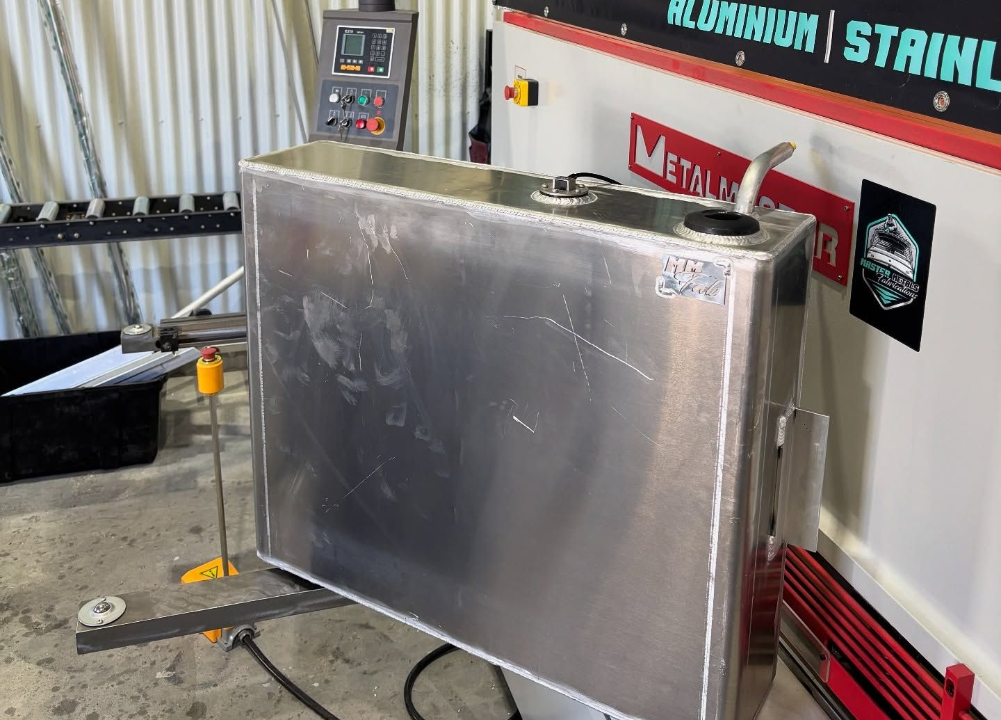 A Large, Rectangular Aluminum Fuel Tank. It Has a Filler Neck — Master Metals Fabrication in Labrador, QLD