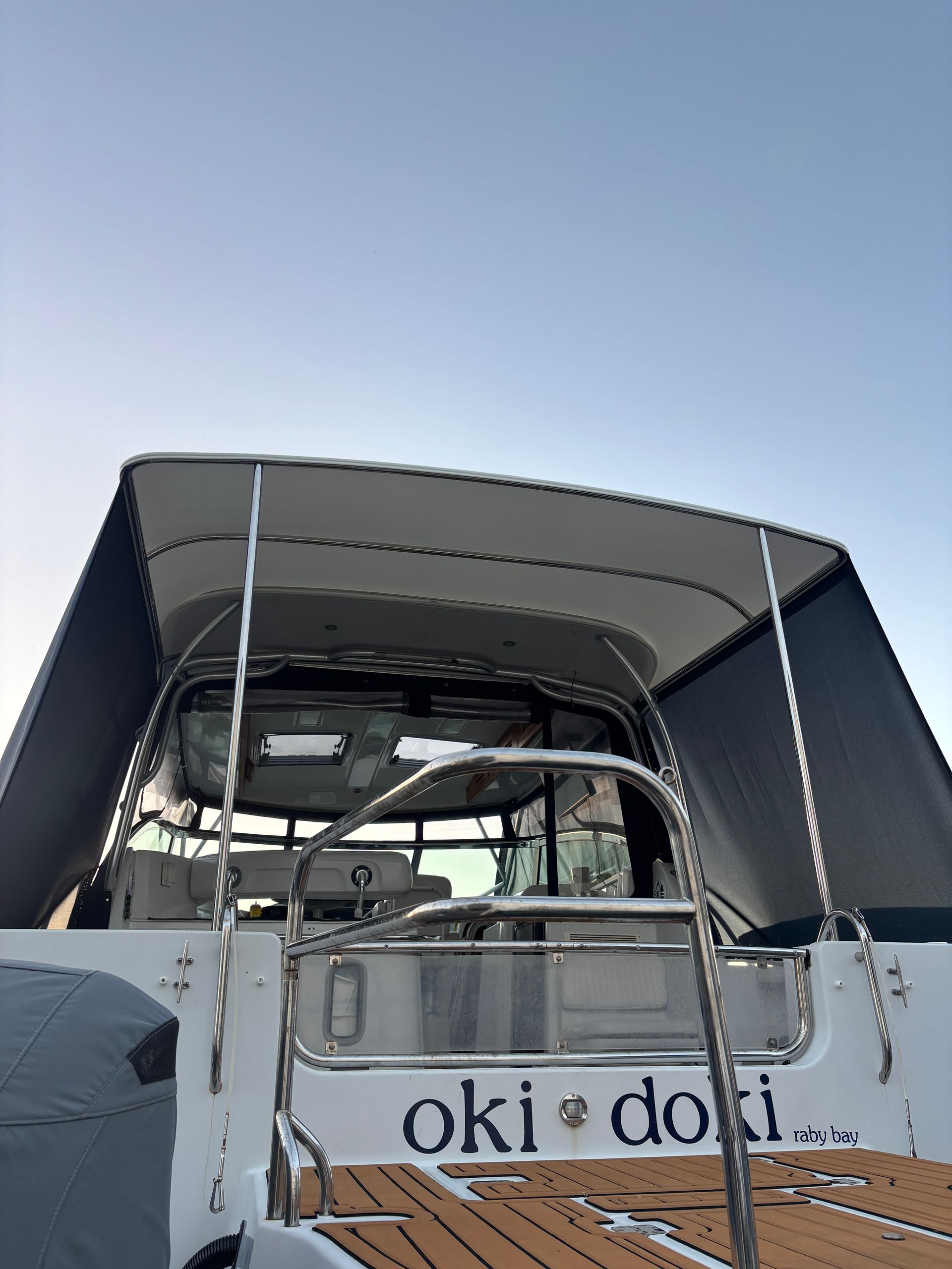 Boat's Black Sunshade Against a Blue Sky, Metal Railing — Master Metals Fabrication in Labrador, QLD