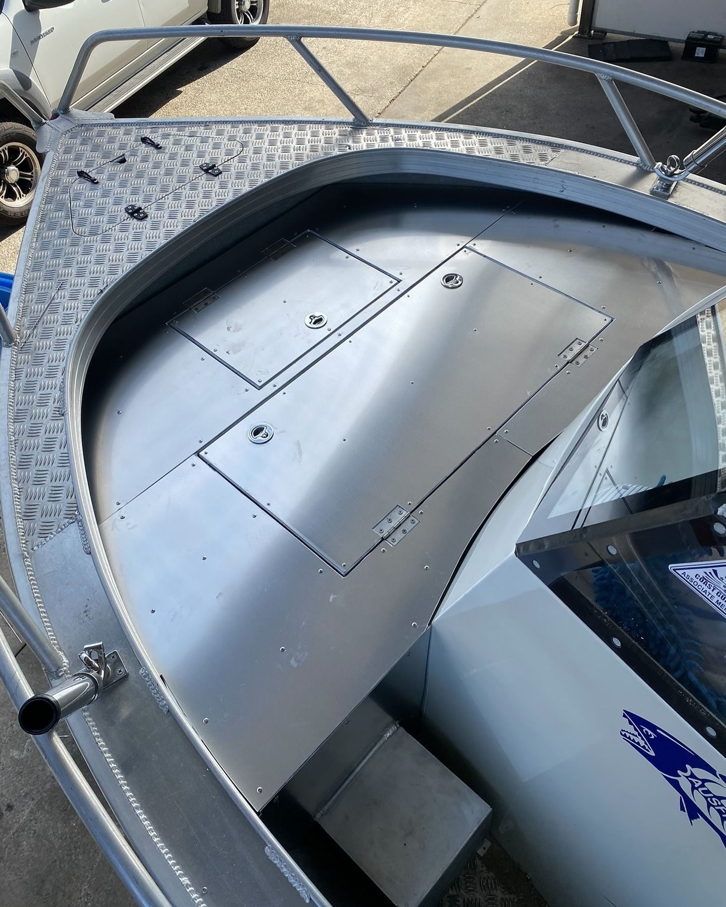 Interior of a Small Aluminum Boat With Storage Compartments and a Curved Front — Master Metals Fabrication in Labrador, QLD