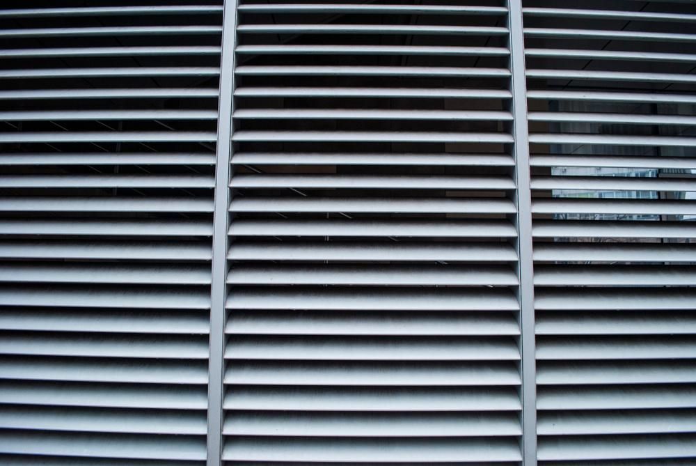 Gray Horizontal Metal Ventilation Slats, Seen From Close Up — My Timber Flooring Blinds & Shutters in Erina, NSW