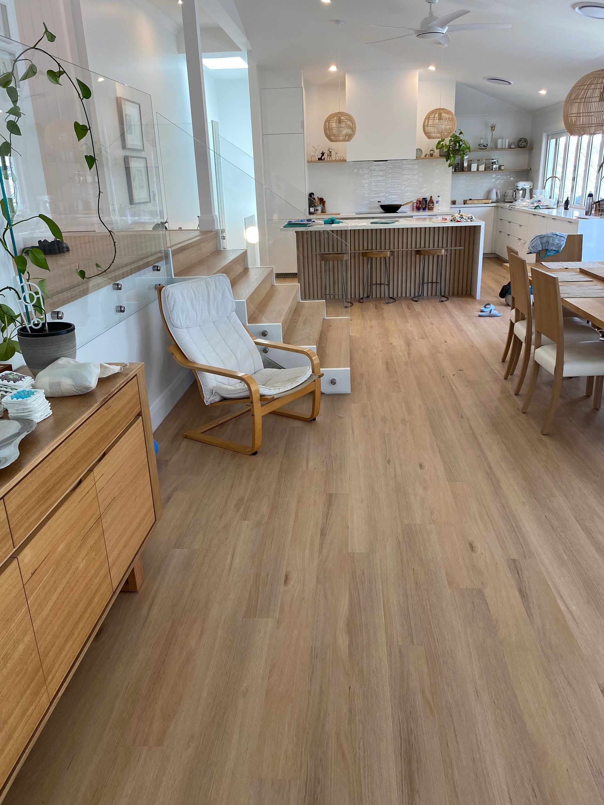 Spacious Light-toned Room With Wood Floors, Kitchen, and Dining Area — My Timber Flooring Blinds & Shutters in Erina, NSW