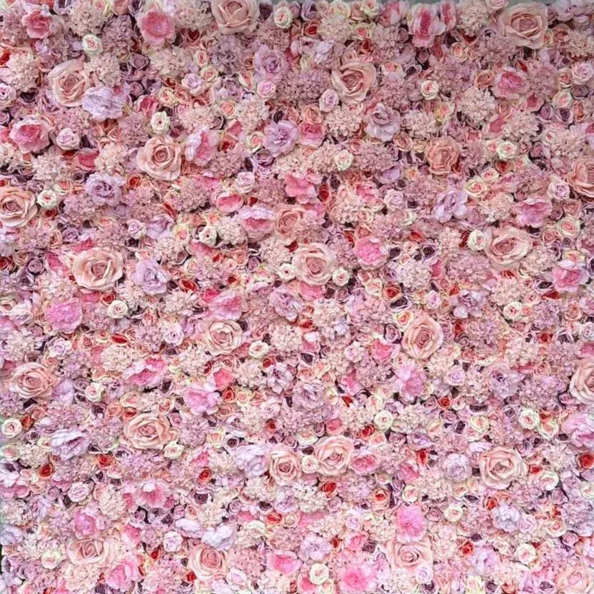 Pink and blush flower wall backdrop filled with roses and other blooms.
