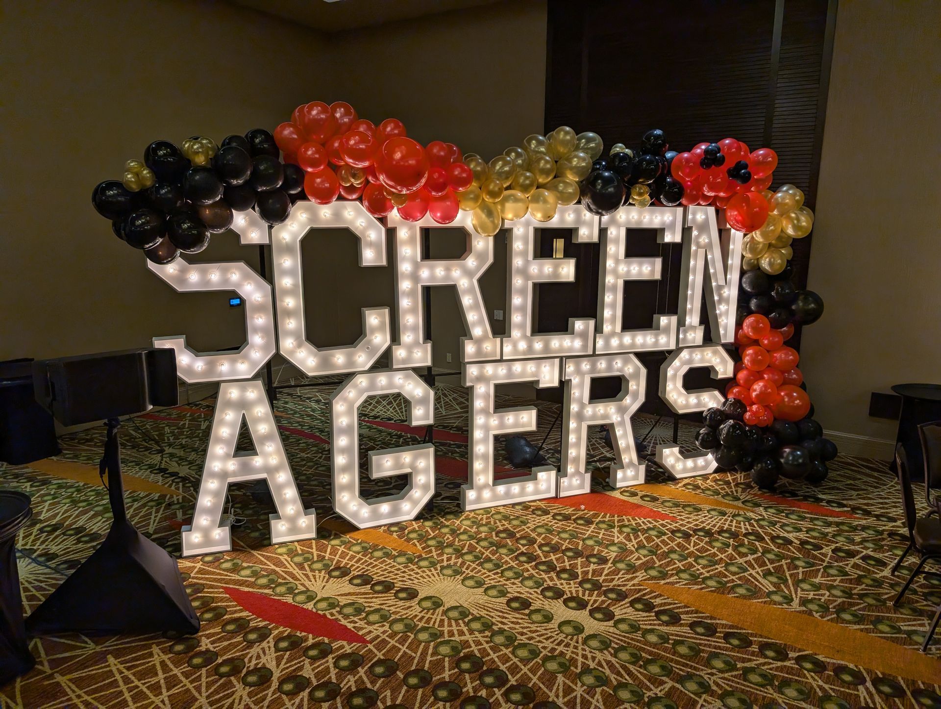 Large illuminated letters spell